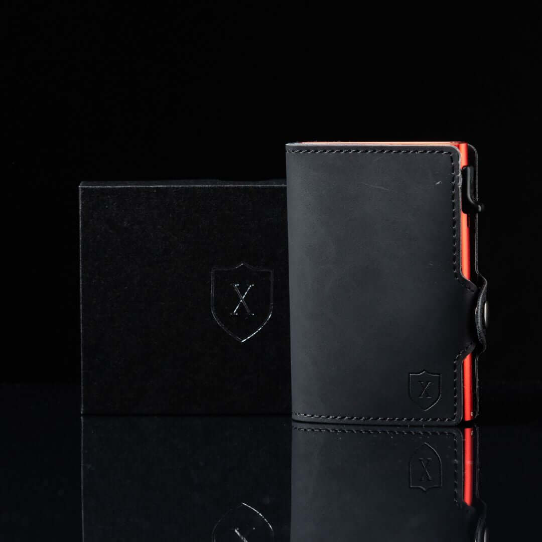 Billetera Xclusive Modelo Deluxe Black & Red vista frontal con su caja de regalo